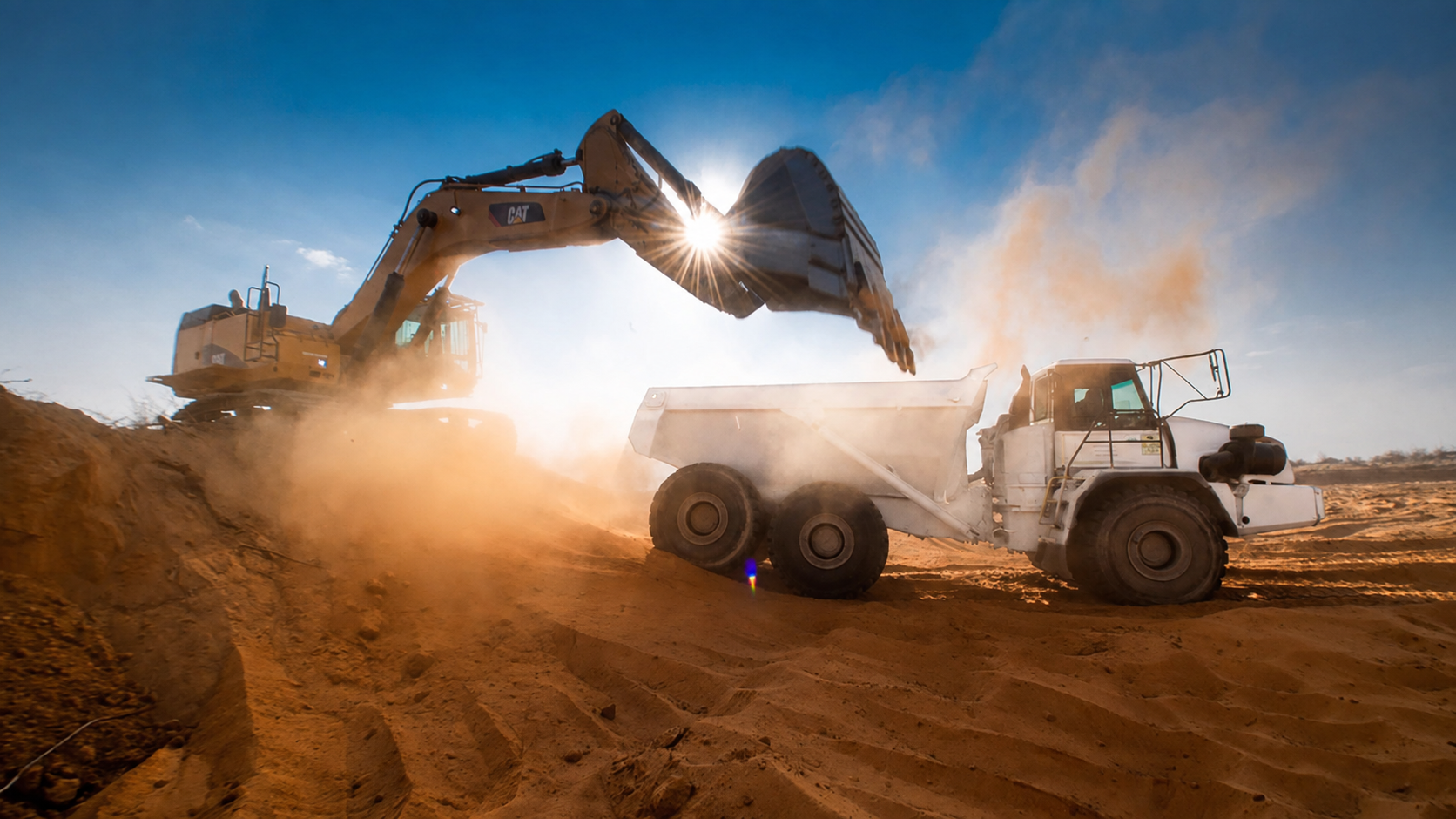 Loading a white earthmoving truck